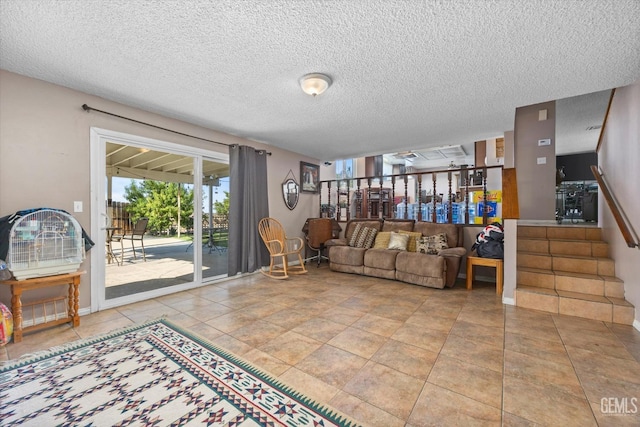 living room with tile patterned floors and a textured ceiling