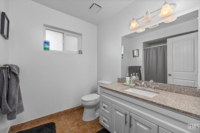 bathroom featuring a shower with curtain, tile patterned flooring, vanity, and toilet