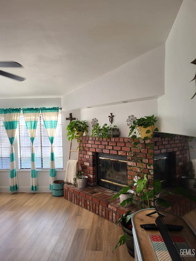 9101 Kern Island St, Bakersfield, CA 93307 - living room with a fireplace, wood finished floors, and a ceiling fan