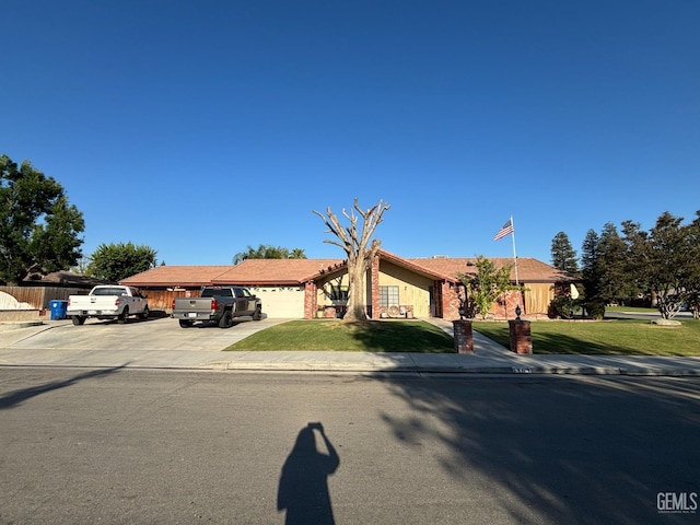 9101 Kern Island St, Bakersfield, CA 93307 - view of front of property featuring an attached garage and driveway