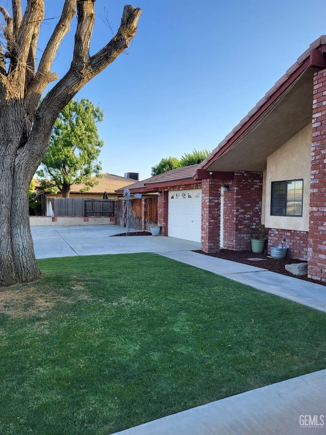 9101 Kern Island St, Bakersfield, CA 93307 - view of yard with an attached garage
