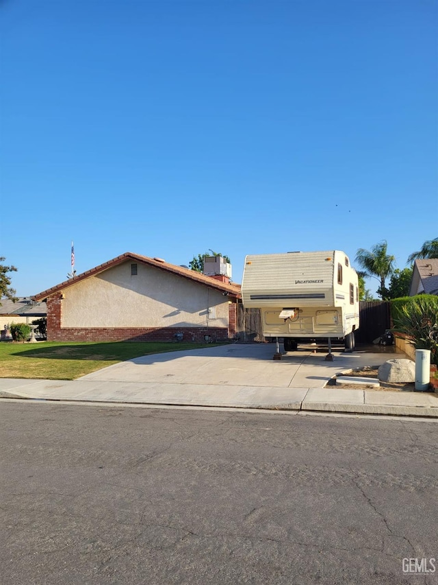 9101 Kern Island St, Bakersfield, CA 93307 - view of front of house featuring driveway