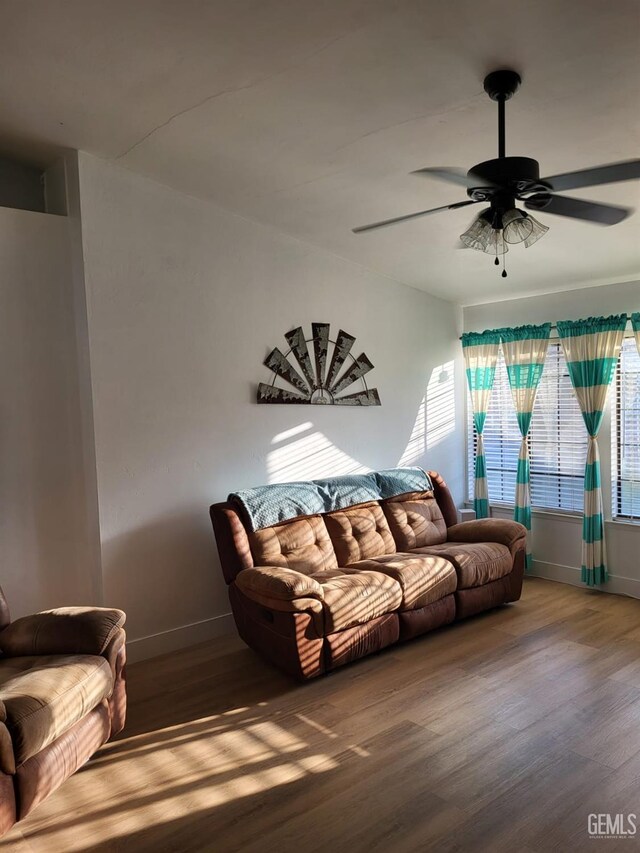9101 Kern Island St, Bakersfield, CA 93307 - living area with wood finished floors and a ceiling fan