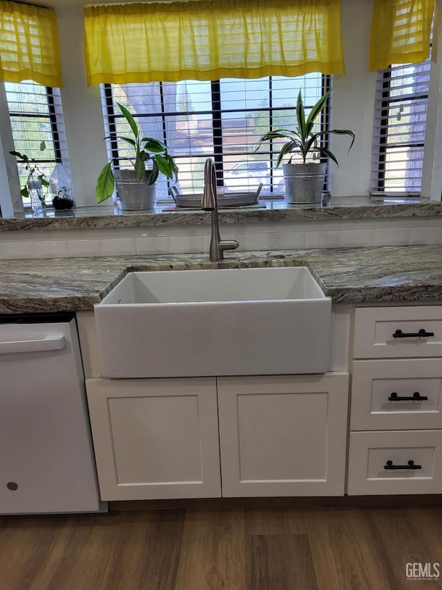 9101 Kern Island St, Bakersfield, CA 93307 - kitchen featuring white dishwasher, plenty of natural light, and white cabinets
