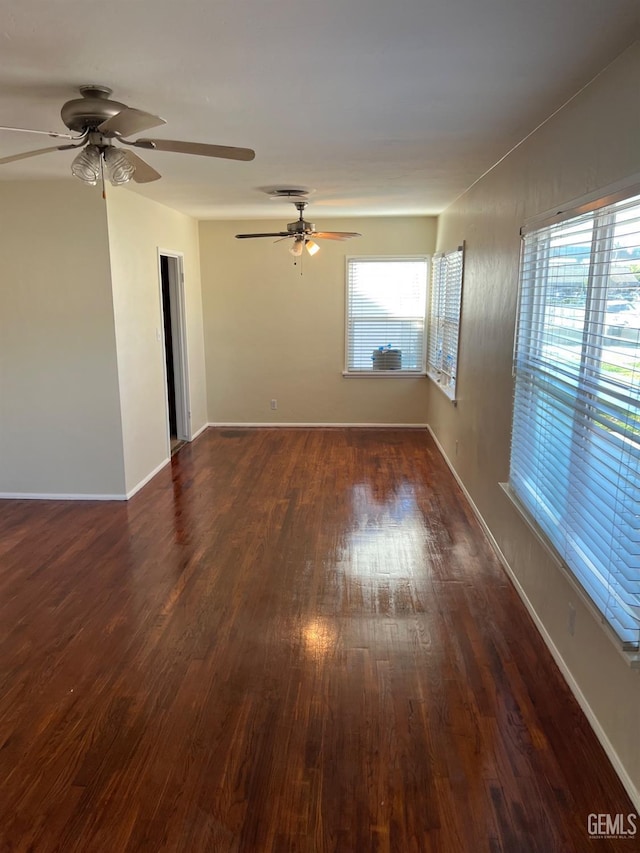 spare room with dark hardwood / wood-style flooring