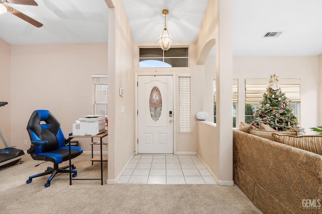 entryway featuring ceiling fan and light tile patterned floors