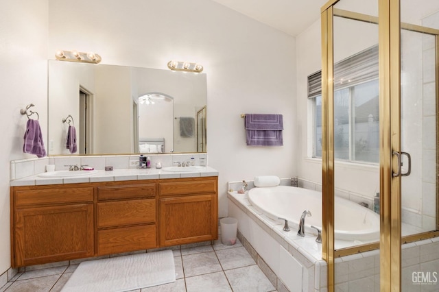 bathroom with separate shower and tub, tile patterned flooring, and vanity