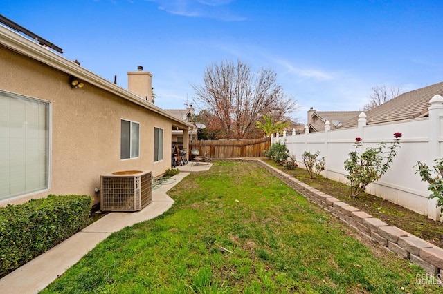 view of yard featuring central AC unit