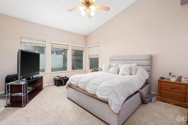 bedroom featuring light carpet, vaulted ceiling, and ceiling fan