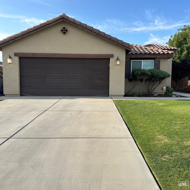 mediterranean / spanish-style house featuring an attached garage, concrete driveway, a tile roof, and stucco siding