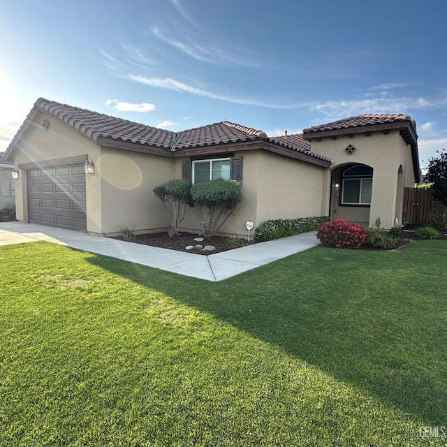 mediterranean / spanish-style house with a garage, a front lawn, fence, stucco siding, and a tile roof