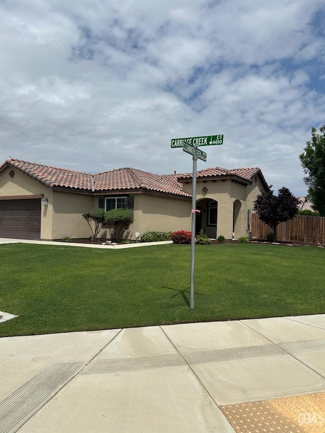 9400 Carriage Creek Ct, Bakersfield, CA 93311 - mediterranean / spanish house featuring stucco siding, a garage, and a tile roof