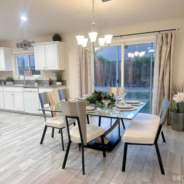 9400 Carriage Creek Ct, Bakersfield, CA 93311 - dining space featuring a chandelier, light wood-style flooring, and recessed lighting