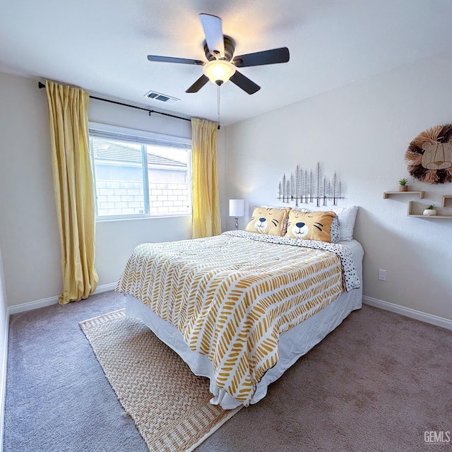 bedroom with visible vents, baseboards, carpet floors, and ceiling fan