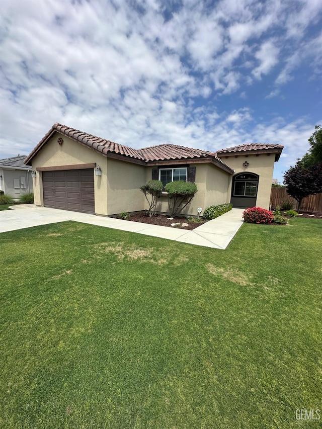 9400 Carriage Creek Ct, Bakersfield, CA 93311 - mediterranean / spanish-style home with stucco siding, a garage, driveway, and a tile roof