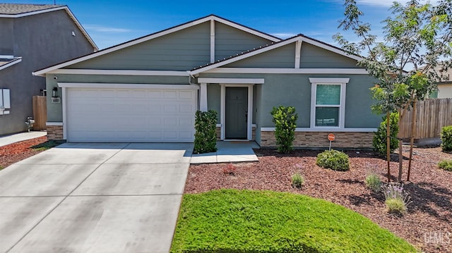 6003 Vespucci Ave, Bakersfield, CA 93313 - single story home with stone siding, a garage, concrete driveway, and stucco siding