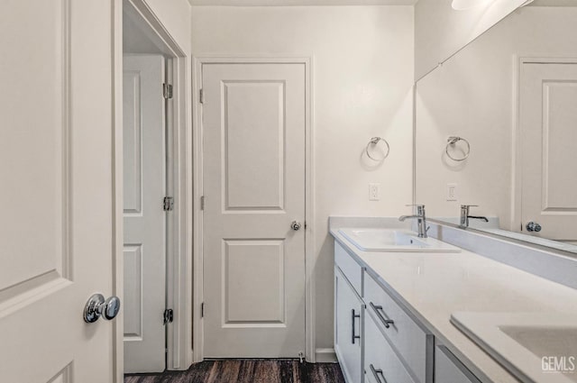 6003 Vespucci Ave, Bakersfield, CA 93313 - full bathroom featuring double vanity and wood finished floors