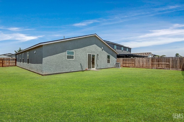 6003 Vespucci Ave, Bakersfield, CA 93313 - rear view of property featuring a fenced backyard and stucco siding
