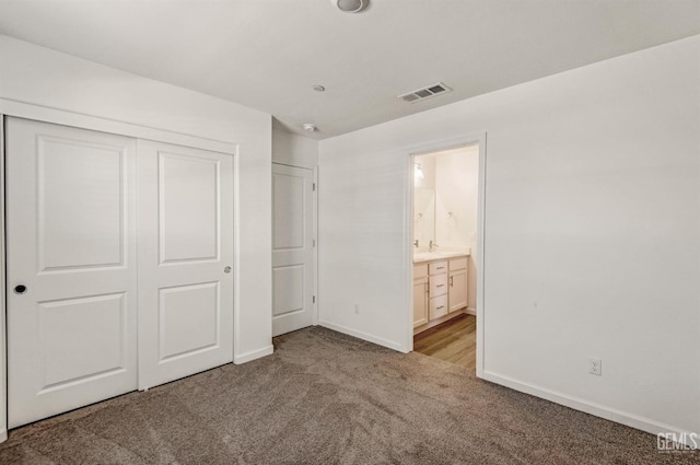 6003 Vespucci Ave, Bakersfield, CA 93313 - unfurnished bedroom with light carpet, a closet, and ensuite bathroom