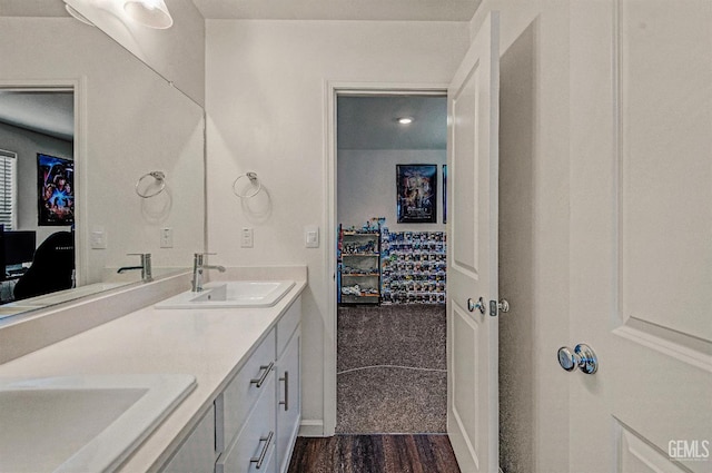 6003 Vespucci Ave, Bakersfield, CA 93313 - bathroom featuring double vanity and wood finished floors