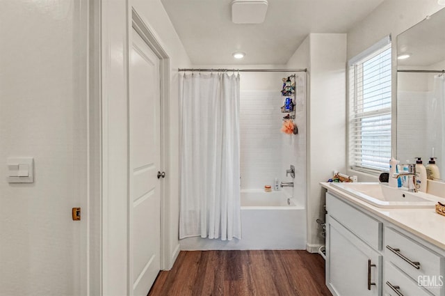 6003 Vespucci Ave, Bakersfield, CA 93313 - full bathroom with vanity, wood finished floors, and shower / bath combo