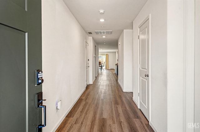 6003 Vespucci Ave, Bakersfield, CA 93313 - corridor featuring wood finished floors and baseboards