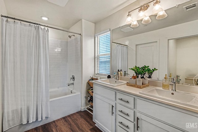 6003 Vespucci Ave, Bakersfield, CA 93313 - bathroom featuring shower / bath combo, double vanity, and wood finished floors