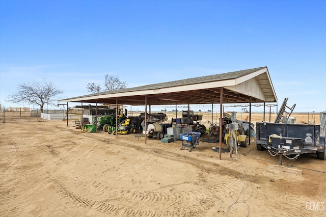 view of vehicle parking featuring an exterior structure