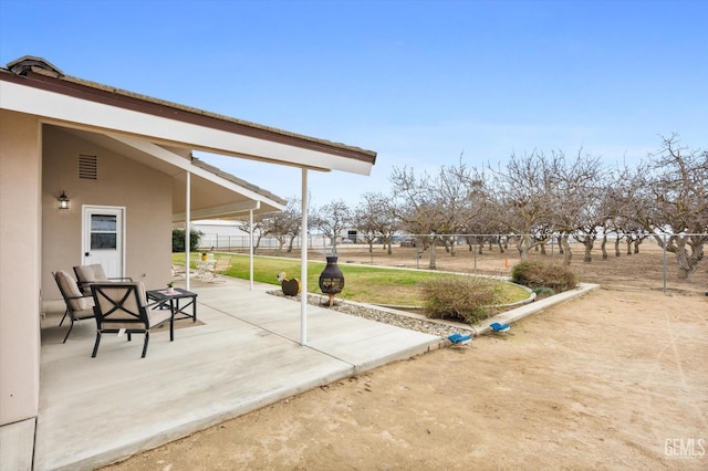 view of patio with fence