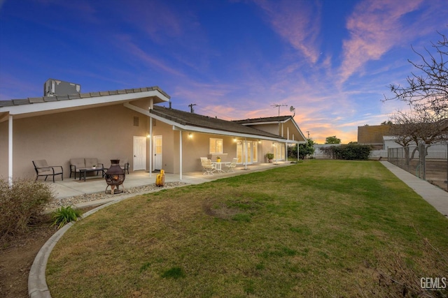 back of house with a patio, a yard, stucco siding, fence, and cooling unit