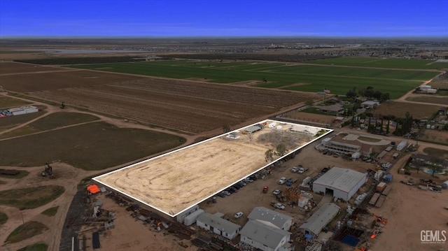 birds eye view of property with a rural view