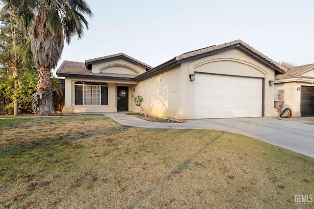 single story home with a garage, a front yard, concrete driveway, and stucco siding