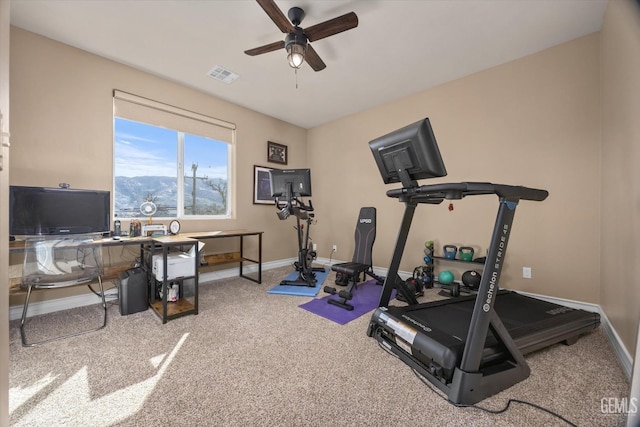 exercise area featuring ceiling fan, carpet, visible vents, and baseboards