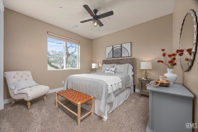 bedroom with carpet, visible vents, ceiling fan, and baseboards