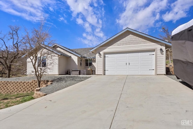 ranch-style house featuring driveway and an attached garage