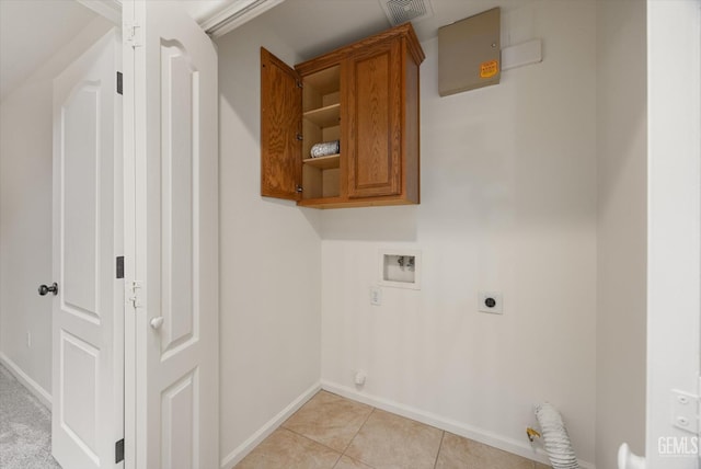 11018 Sonoma Creek Ct, Bakersfield, CA 93312 - laundry area featuring cabinet space, hookup for an electric dryer, washer hookup, baseboards, and light tile patterned flooring