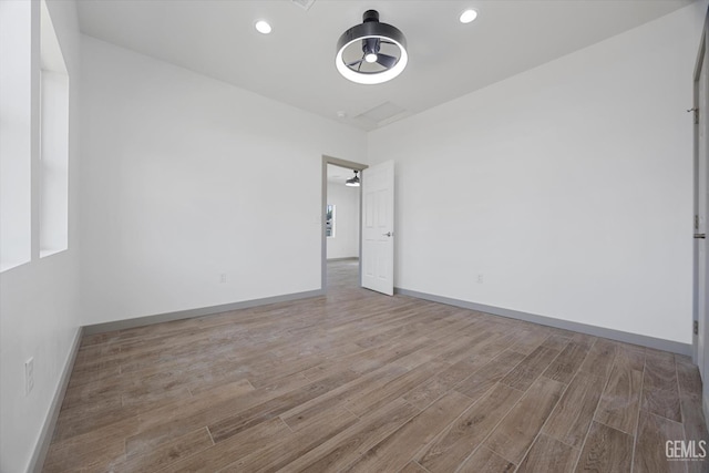 329 F St, Bakersfield, CA 93304 - empty room with wood finished floors, baseboards, and recessed lighting