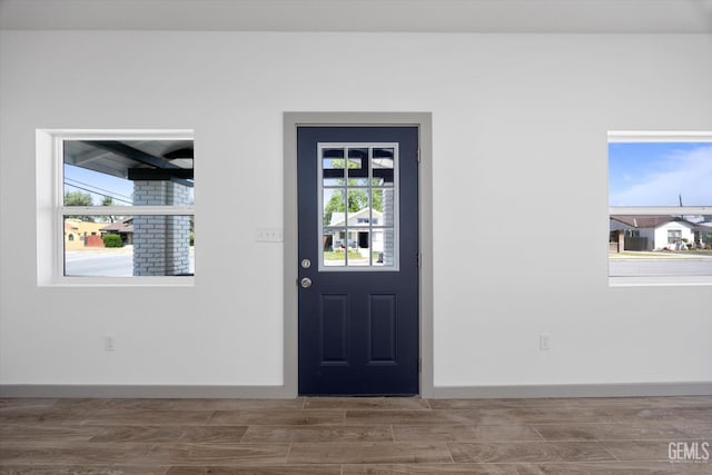 329 F St, Bakersfield, CA 93304 - entrance foyer featuring plenty of natural light, wood finished floors, and baseboards