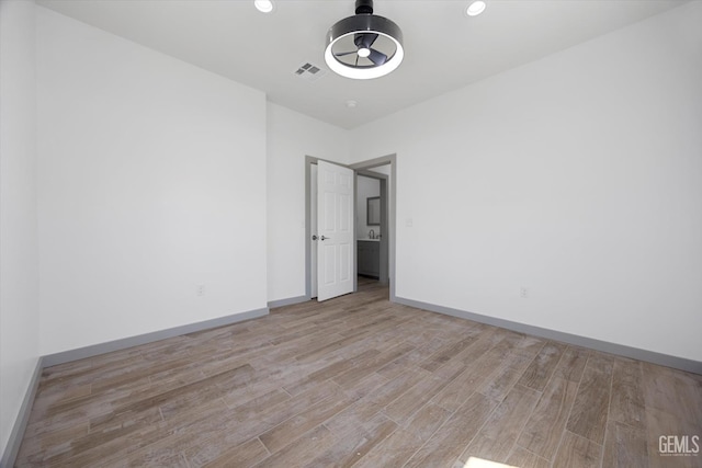 329 F St, Bakersfield, CA 93304 - spare room featuring wood finished floors, baseboards, and recessed lighting