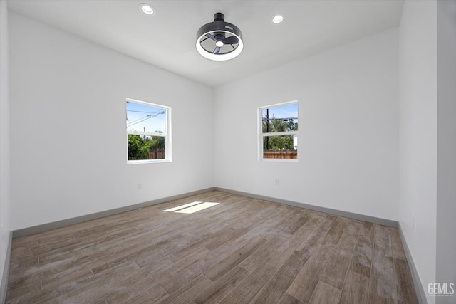 329 F St, Bakersfield, CA 93304 - empty room with plenty of natural light, wood finished floors, baseboards, and recessed lighting