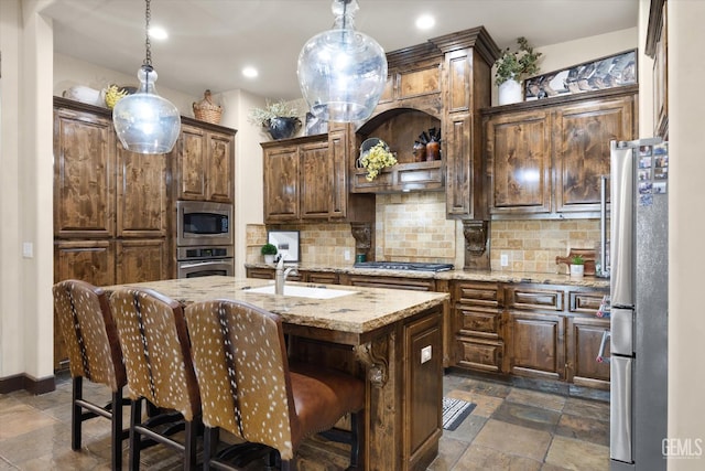 9200 Bridget Leigh Way, Bakersfield, CA 93312 - kitchen featuring stainless steel appliances, stone tile flooring, tasteful backsplash, and recessed lighting