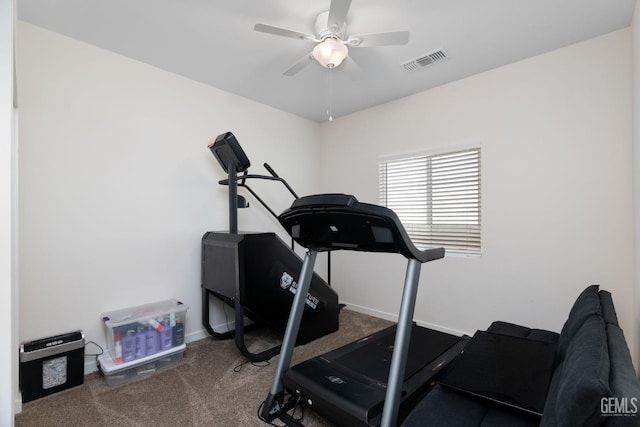 workout area featuring dark carpet and ceiling fan