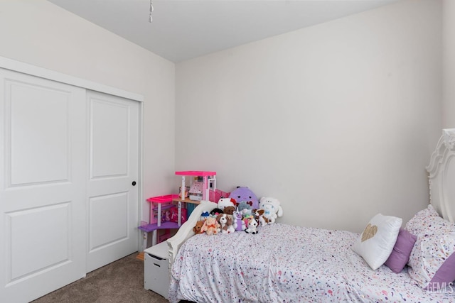 carpeted bedroom featuring a closet