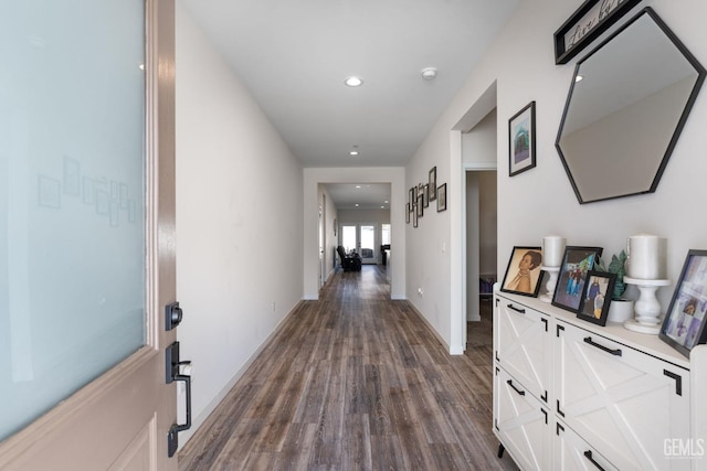 hallway with dark wood-type flooring