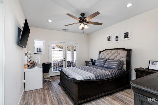 bedroom featuring hardwood / wood-style flooring, access to outside, and ceiling fan