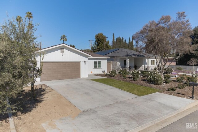 ranch-style house featuring a garage