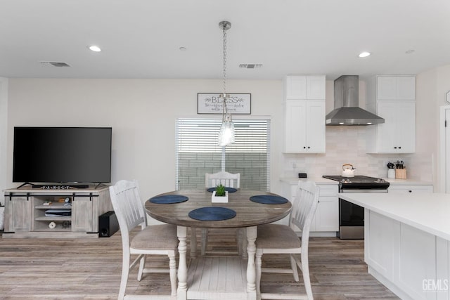 dining room featuring light hardwood / wood-style floors