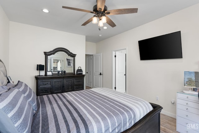 bedroom featuring ceiling fan and light hardwood / wood-style floors