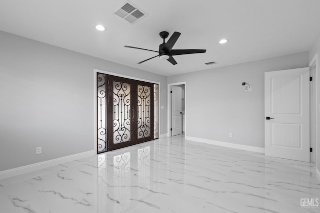 empty room featuring recessed lighting, baseboards, light marble finish floors, and ceiling fan