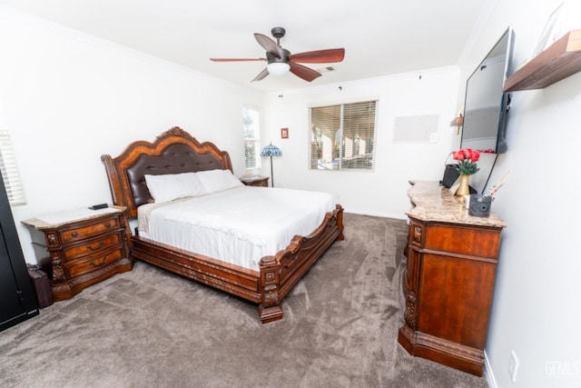 carpeted bedroom with ceiling fan and crown molding